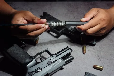 Best professional gun maintenance setup with tools and firearms